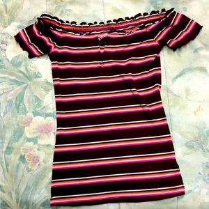 Pink, burgundy, cream colored shirt. V neck. Off the shoulder